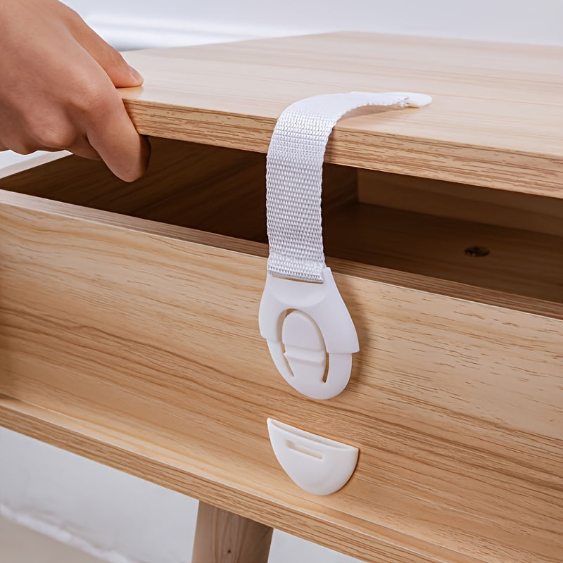 Secure your drawers and cabinets with this 10-pack of white safety locks and straps. Made of lead-free plastic, these adjustable anti-pinch latches are perfect for children aged 3-6 years and 6-8 years. Keep your little ones safe with these easy-to-use