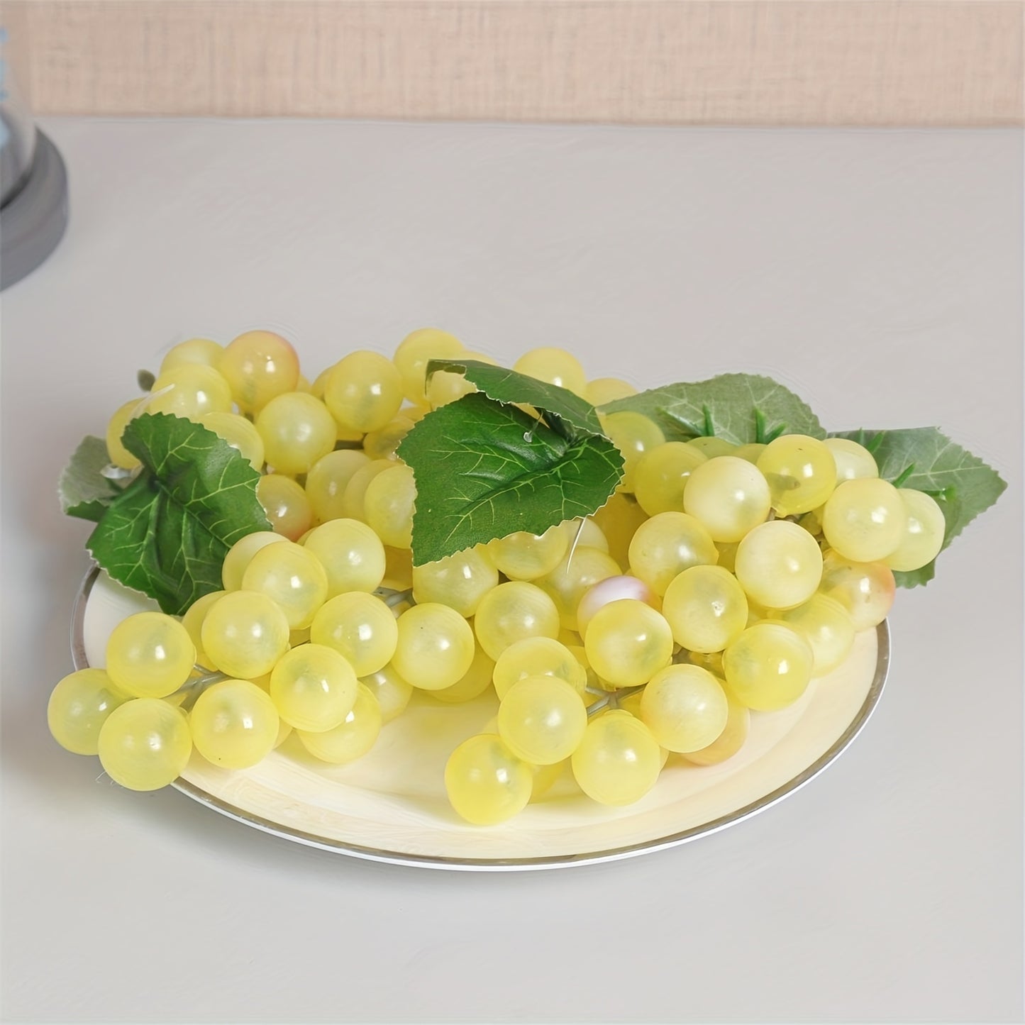 A string of artificial grapes with 36 large beads per string can be hung up for Halloween and Thanksgiving parties, as well as for weddings, kitchen displays, and Christmas gifts.