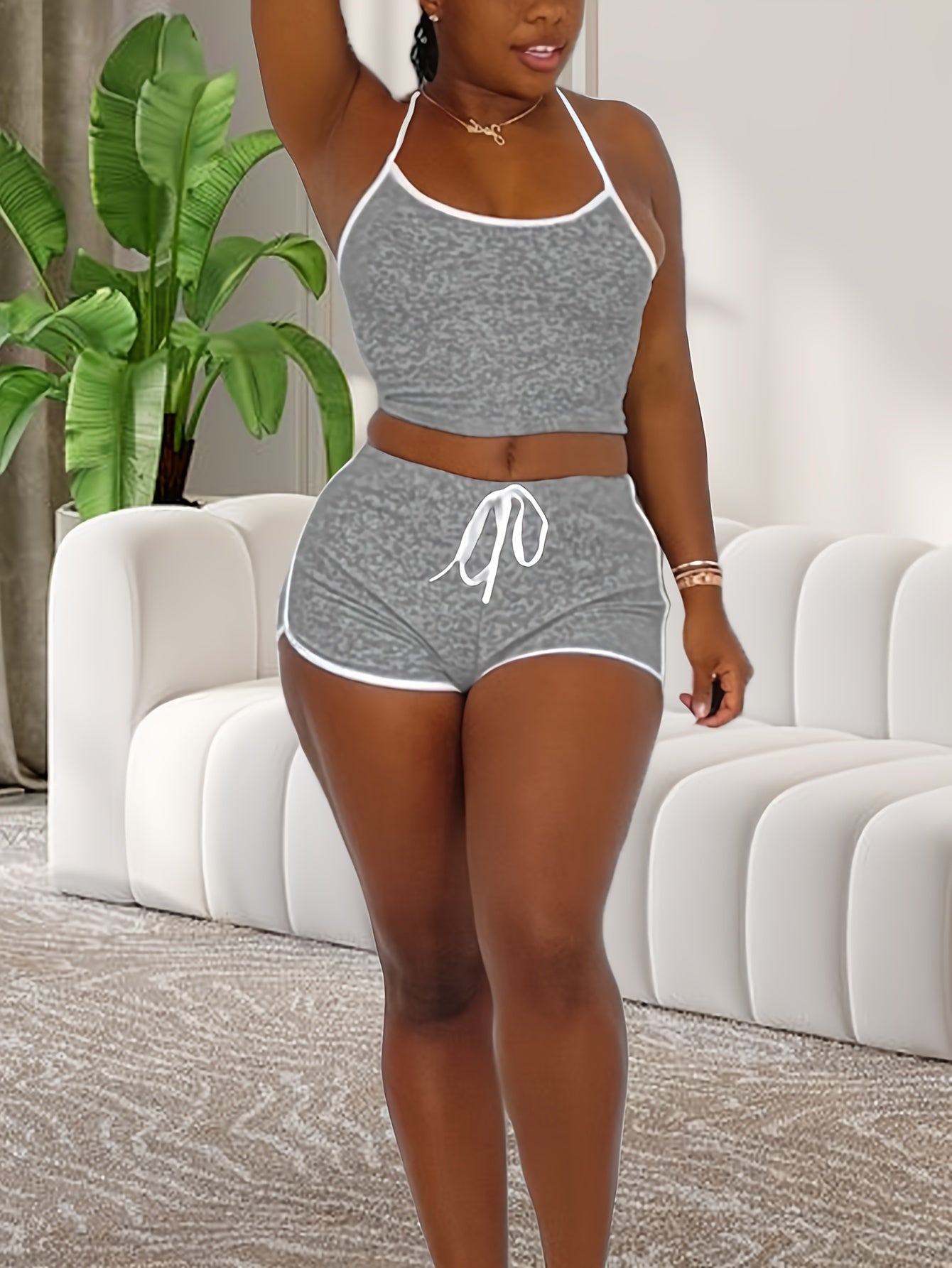 Stylish lounge set with halter neck crop top and elastic shorts for women's sleepwear.