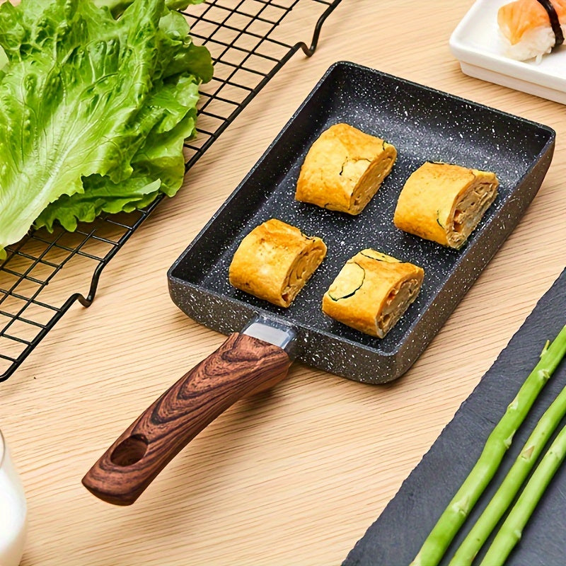 Non-stick Tamagoyaki Japanese omelette pan with imitation wood handle, perfect for frying eggs and cooking breakfast. This skillet is durable and hand wash only, making it an essential non-stick kitchenware item.