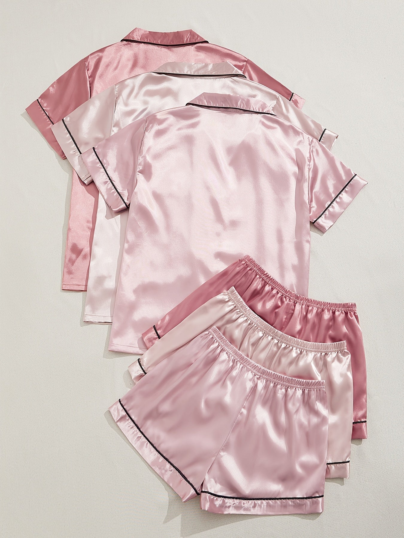 Women's Satin Pajama Set includes short-sleeve top and elastic waistband shorts for sleepwear and loungewear.