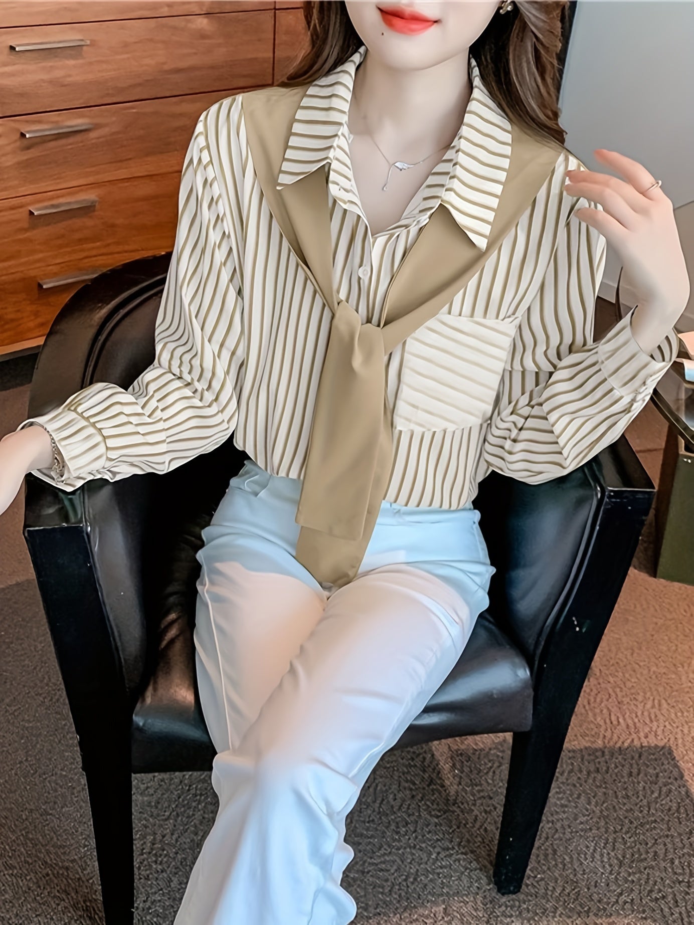 Elegant striped lace-up shirt with long sleeves and single breasted placket made of polyester, perfect for adults in spring/fall. Features a square neck.