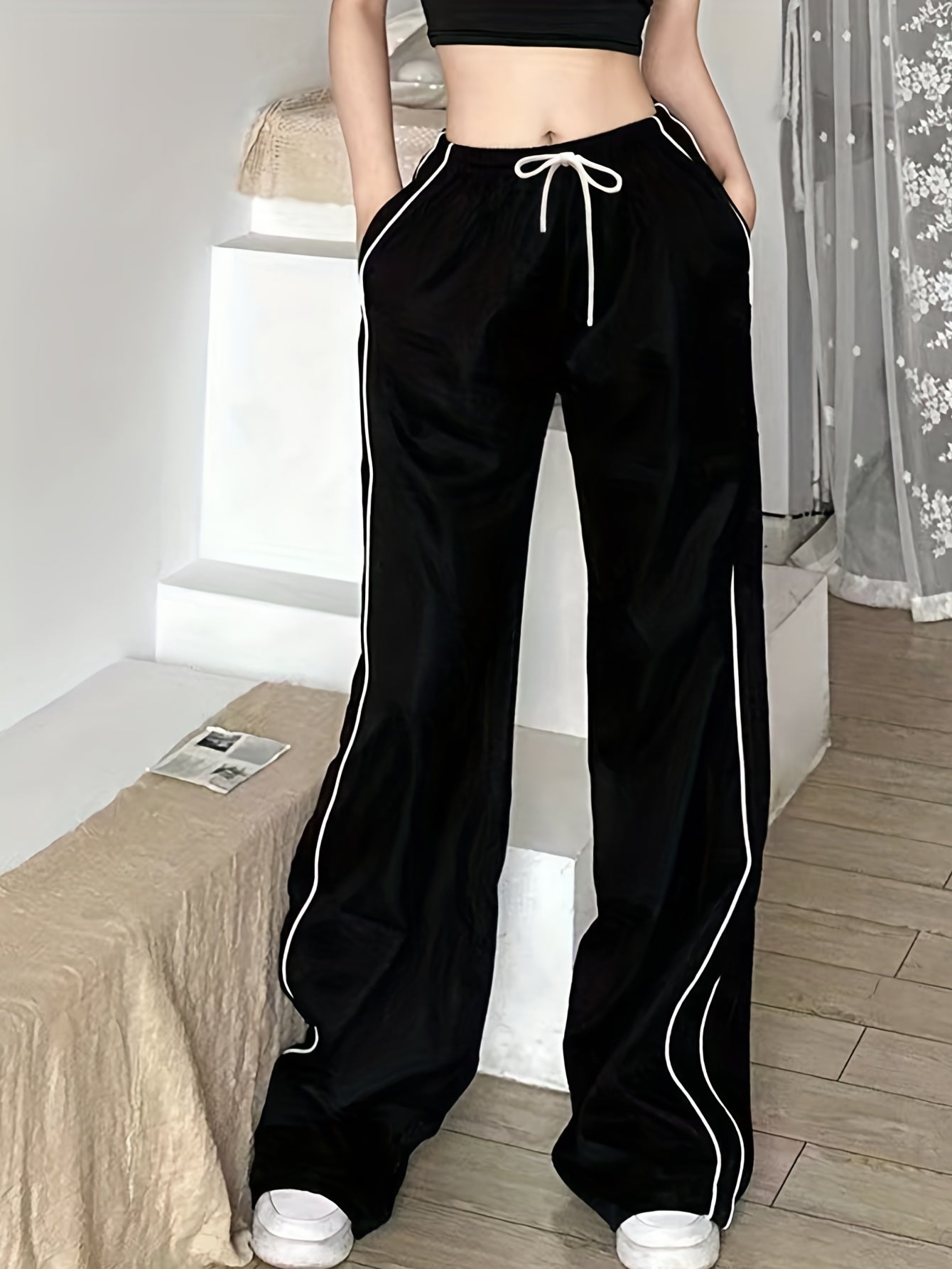 Y2K baggy pants with contrast drawstring waist and slant pockets for women.