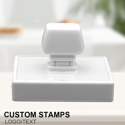 Large, personalized business stamp with custom logo and unique design, ideal for small businesses and office use. Made of ABS material with black ink.