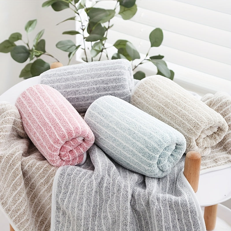 A 140cm*70cm plush bath towel perfect for home, hotel, kitchen, and more. Ultra-absorbent, soft, and gentle on skin.