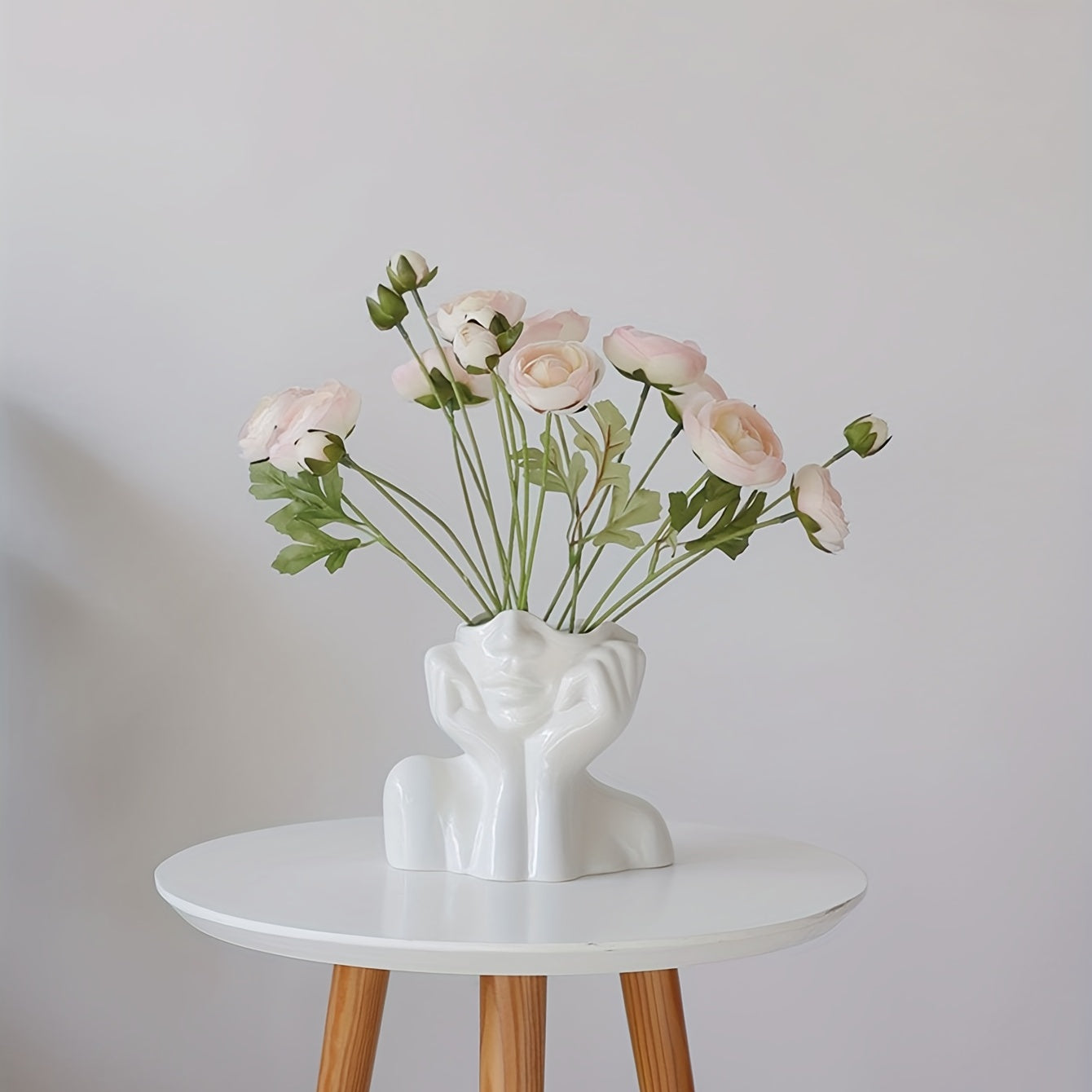 Resin vase with human face design, Nordic home decor, white double-handled vase for tabletop floral display.