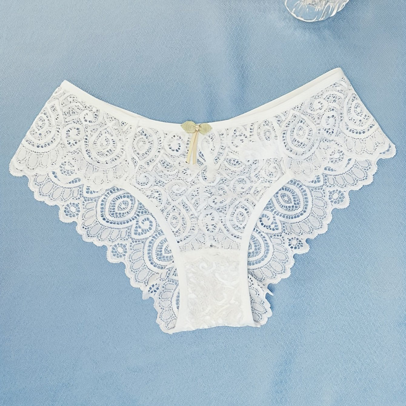 Women's low waist panties made of floral lace with cut outs, breathable and semi-sheer.