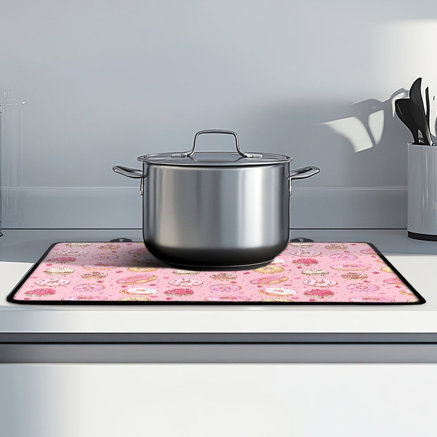 Heat-resistant stovetop cover featuring a fun donut pattern made of durable polyester. This non-slip cooktop protector mat is safe for glass ceramic stovetops and also doubles as a rubber anti-scratch ironing pad. A versatile kitchen accessory that adds