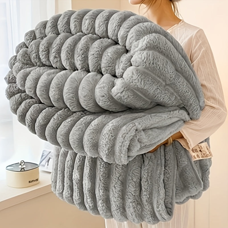 Get cozy with this multifunctional blanket made of ultra-soft milk fleece. Featuring a modern striped texture, this blanket is perfect for all-season comfort on your bed, sofa, or even while camping. Machine washable for easy care, this blanket is an