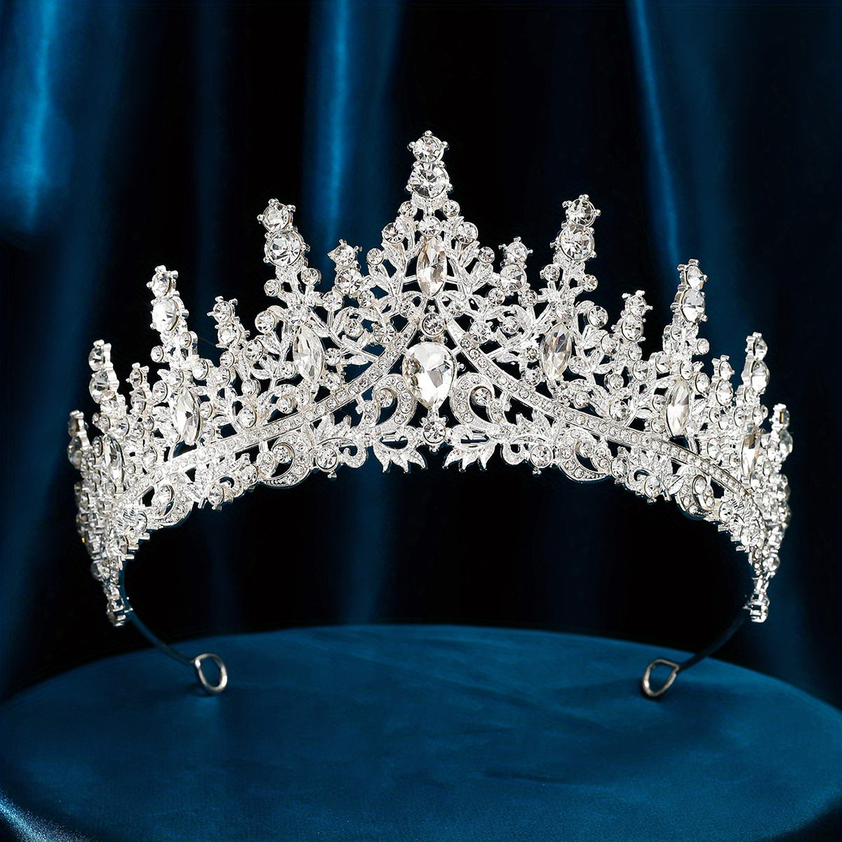 Silver alloy rhinestone tiara for elegant weddings and parties.