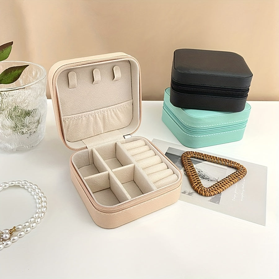 Compact faux leather jewelry organizer box for rings, necklaces, earrings & more. Portable travel case with multi-purpose storage solution. Rectangle shape for organizing.