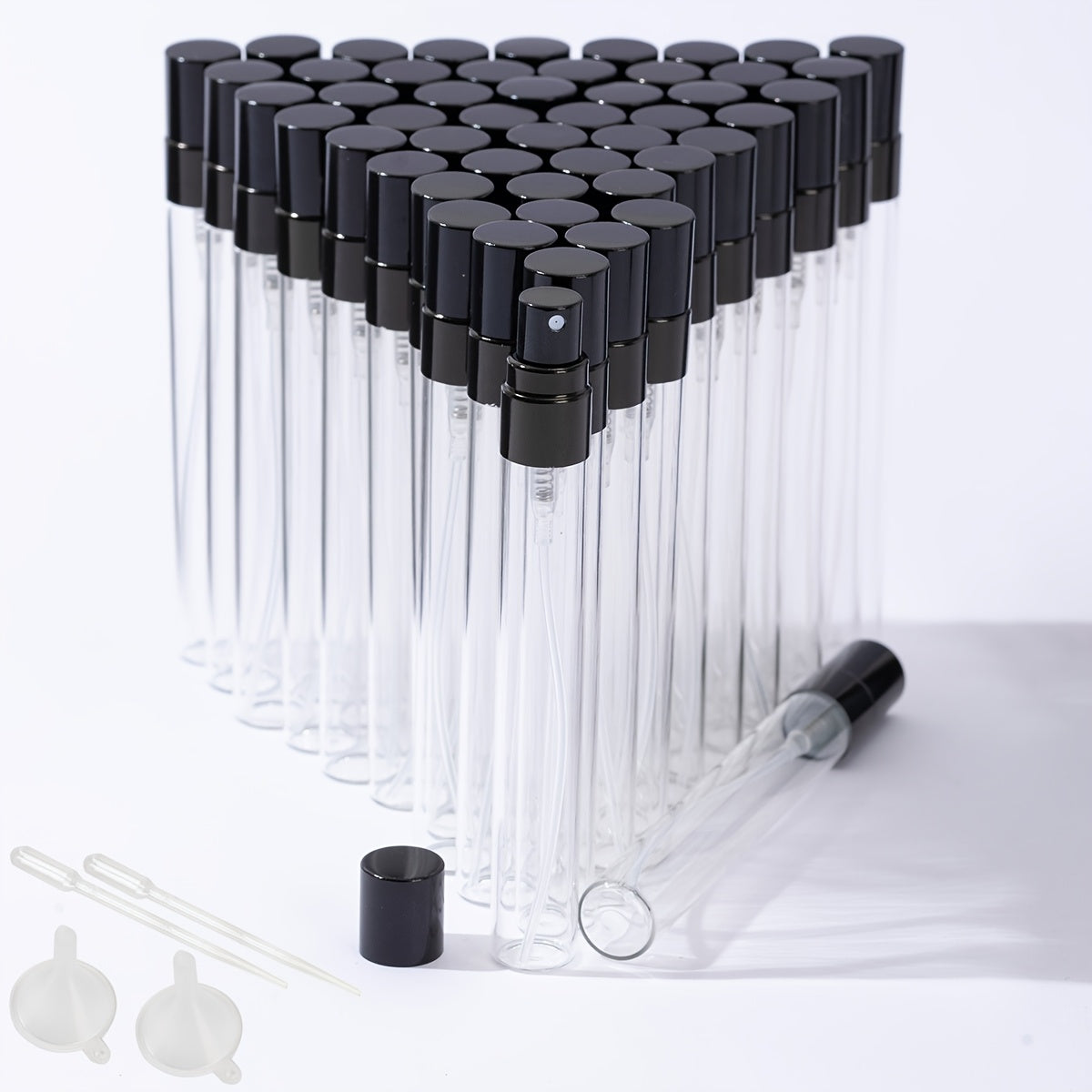 50 transparent glass bottles for decanting 5ml and 10ml perfumes, with spray tops.