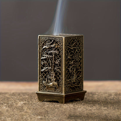 Stylish incense burner with bamboo and plum blossom design in copper/gold finish for home or office décor.