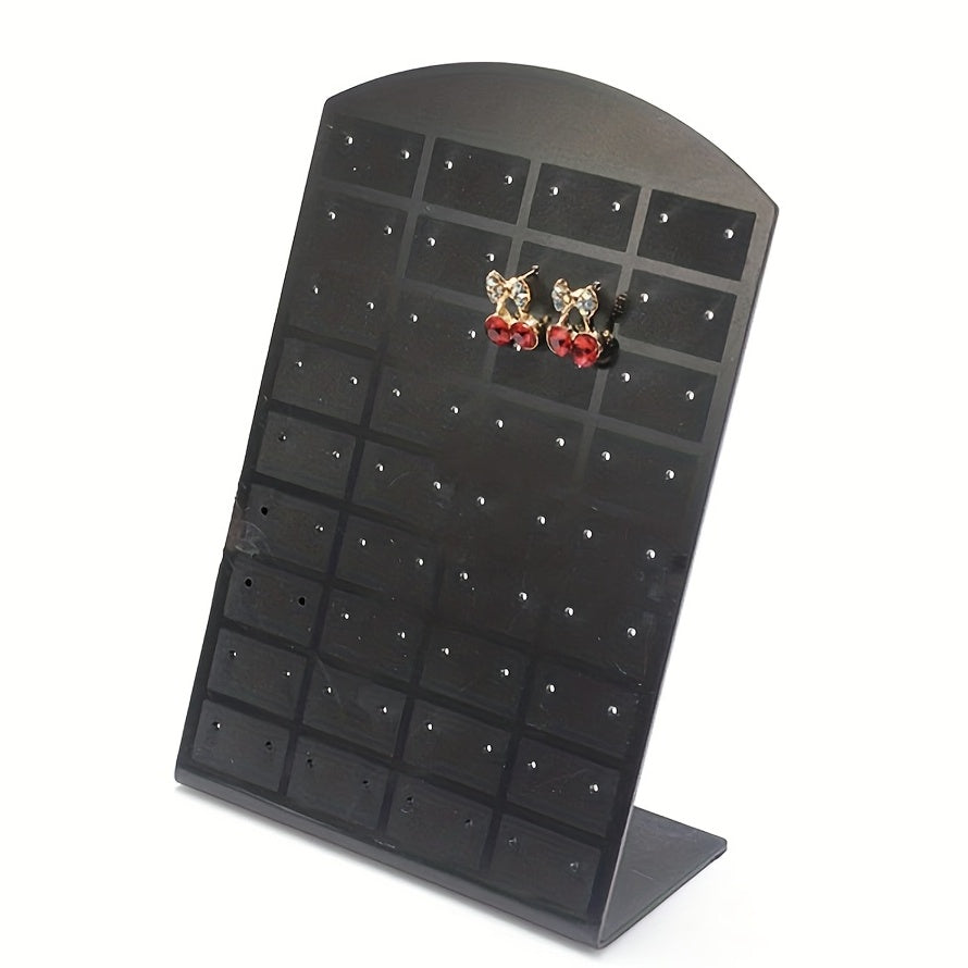 Acrylic earrings holder with 72 holes for ear studs display, made from plastic material. Can be used as a jewelry organizer and storage rack.