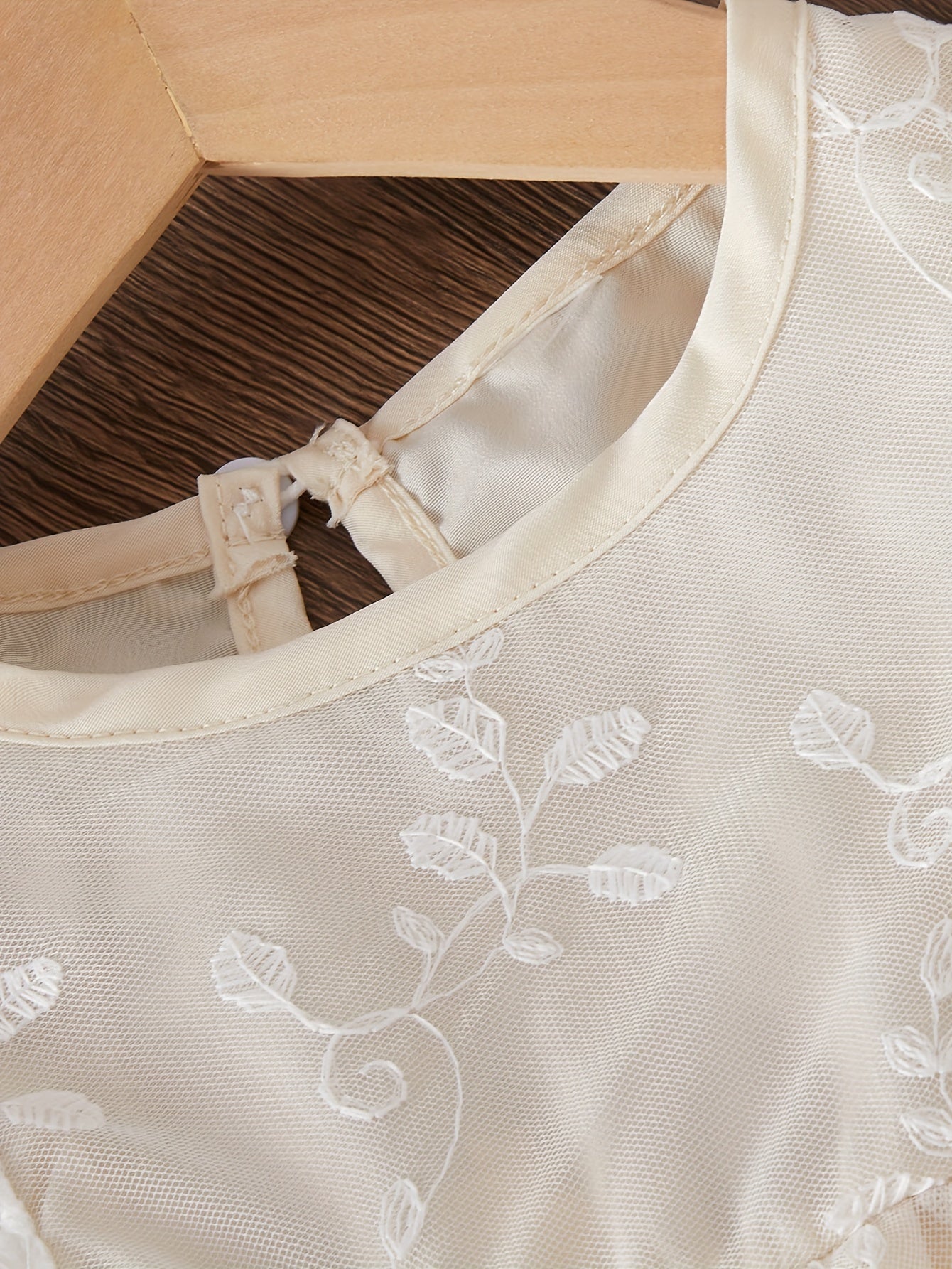 Infant girls' mesh dress with floral embroidery and chic style.