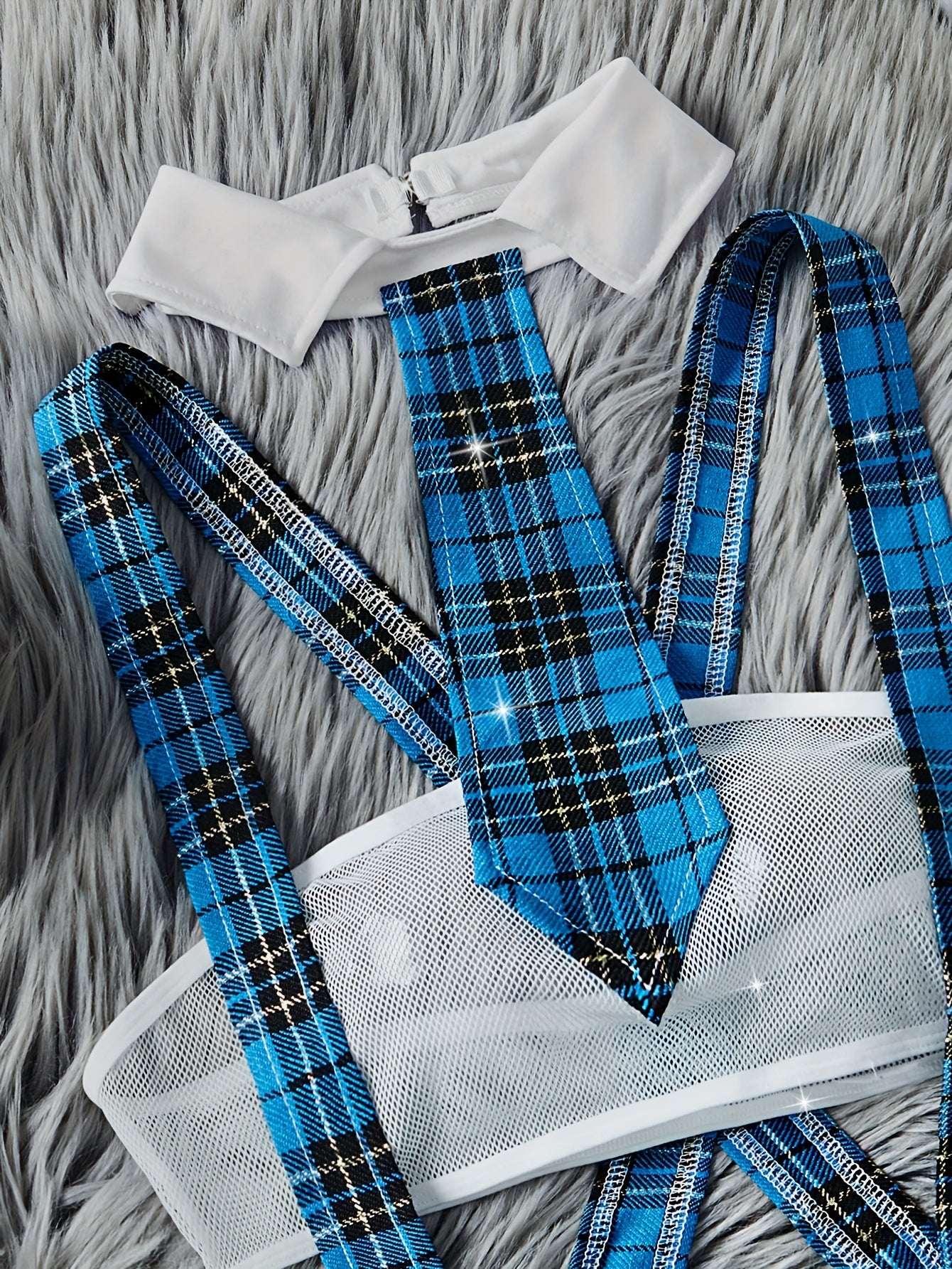 Color block plaid role-playing costume set includes strapless bra, suspender skirt, thong, and tie. Perfect for women's exotic clothing and sexy lingerie.