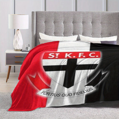 Stay warm and cozy with the St Kilda Australian Rules Football Club Printed Fleece Blanket. This soft and snug throw blanket is ideal for napping, whether on the sofa, in the office, on the bed, or while camping or traveling. It makes a versatile gift