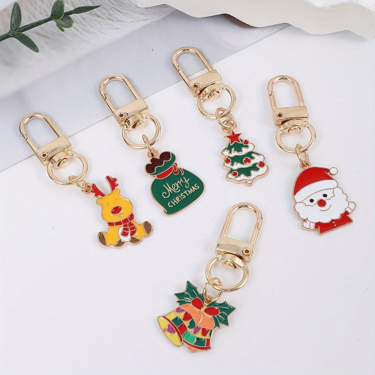 [Top Pick] Set of 16 Christmas-Themed Keychains featuring adorable Cartoon Alloy Metal designs of Santa, Reindeer, Snowflakes, Candy Canes, Bells, and Snowman.