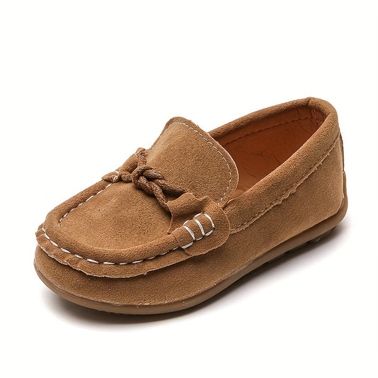 Kids slip-on loafers with soft upper, non-slip sole, breathable lining, bowknot detail, ideal for casual walking indoors and outdoors.