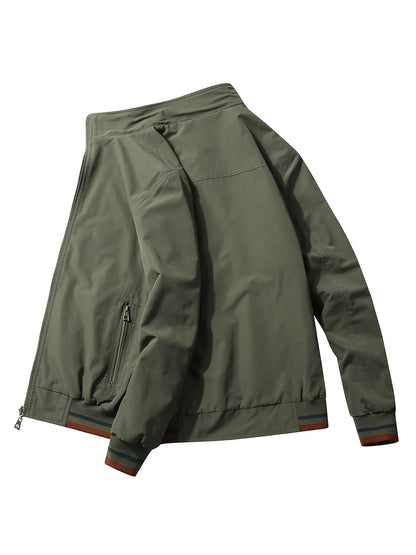 Reversible windproof jacket for men with military-inspired design, zip-up front, pockets, and long sleeves.