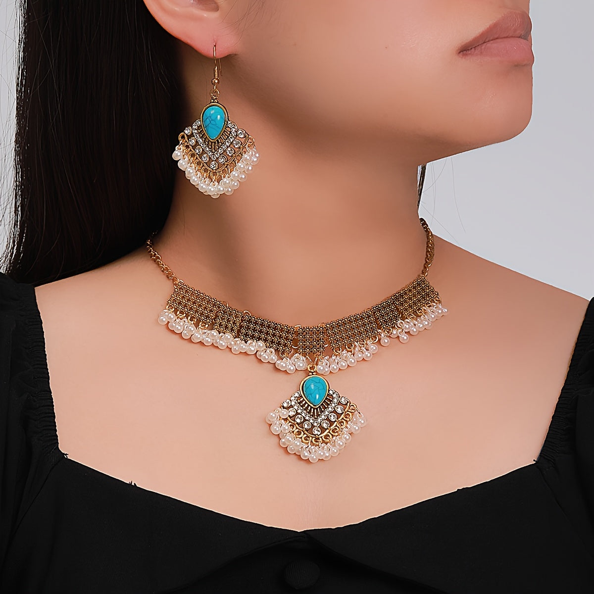 1 Boho style jewelry set featuring a pair of earrings, a necklace, and a ring. Inlaid with natural turquoise, this set is the perfect gift to complement any daily outfit.