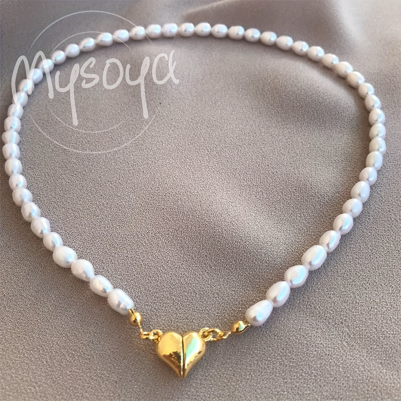 MYSOYA presents a stunning handmade necklace featuring natural freshwater rice-shaped pearls, adorned with a golden or silvery heart. The 6-7mm pearls come beautifully packaged in a gift box, making it a perfect jewelry gift for him or her. Ideal for