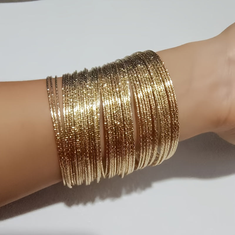 A collection of 30/50 fashionable golden bracelets for women, designed to resemble stars in the sky. These bracelets are perfect for daily wear or make a great gift for vacation.