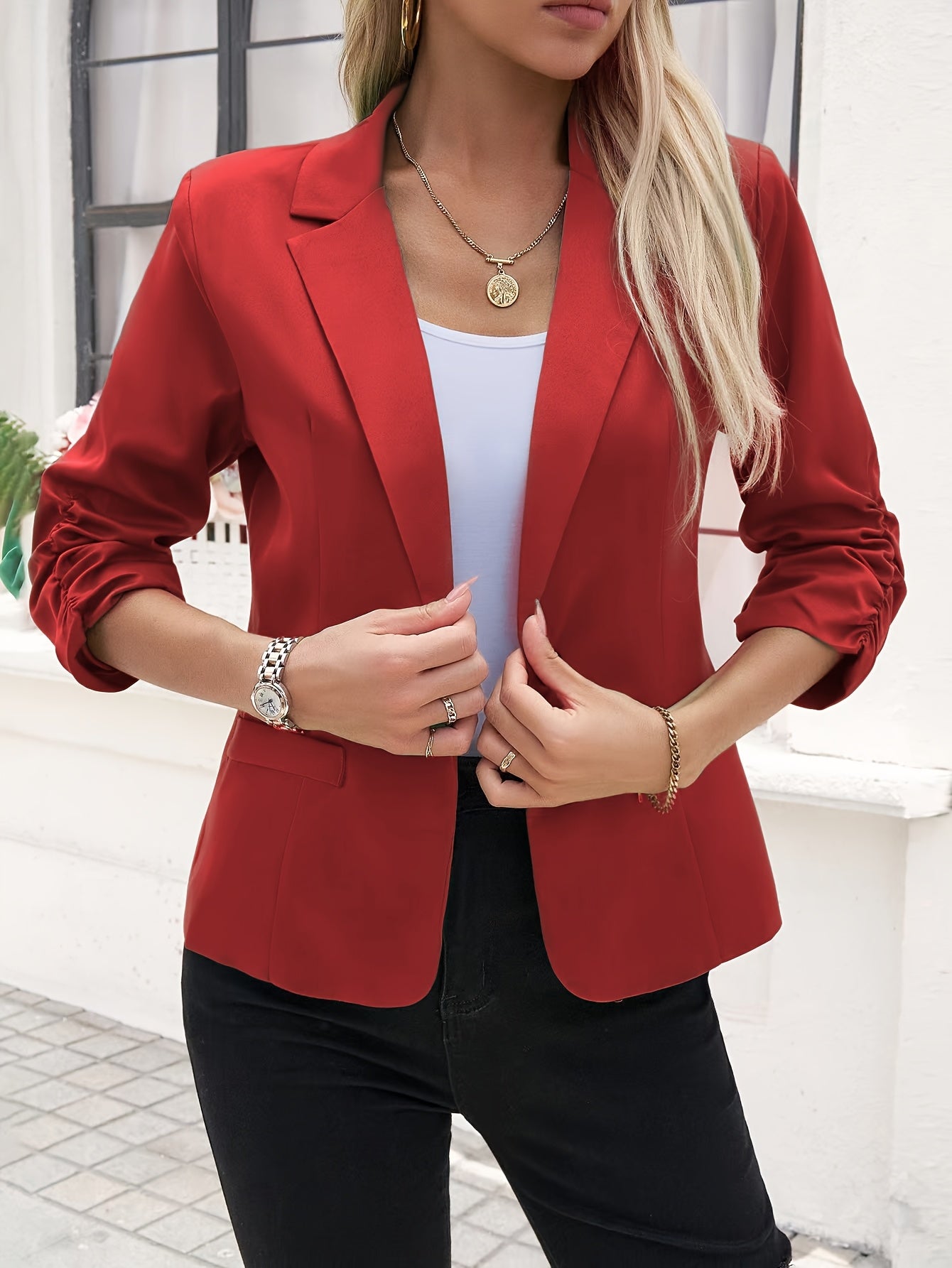 Women's slim-fit casual blazer with a single button placket, roll-up sleeves, and polyester lining for spring/fall season.