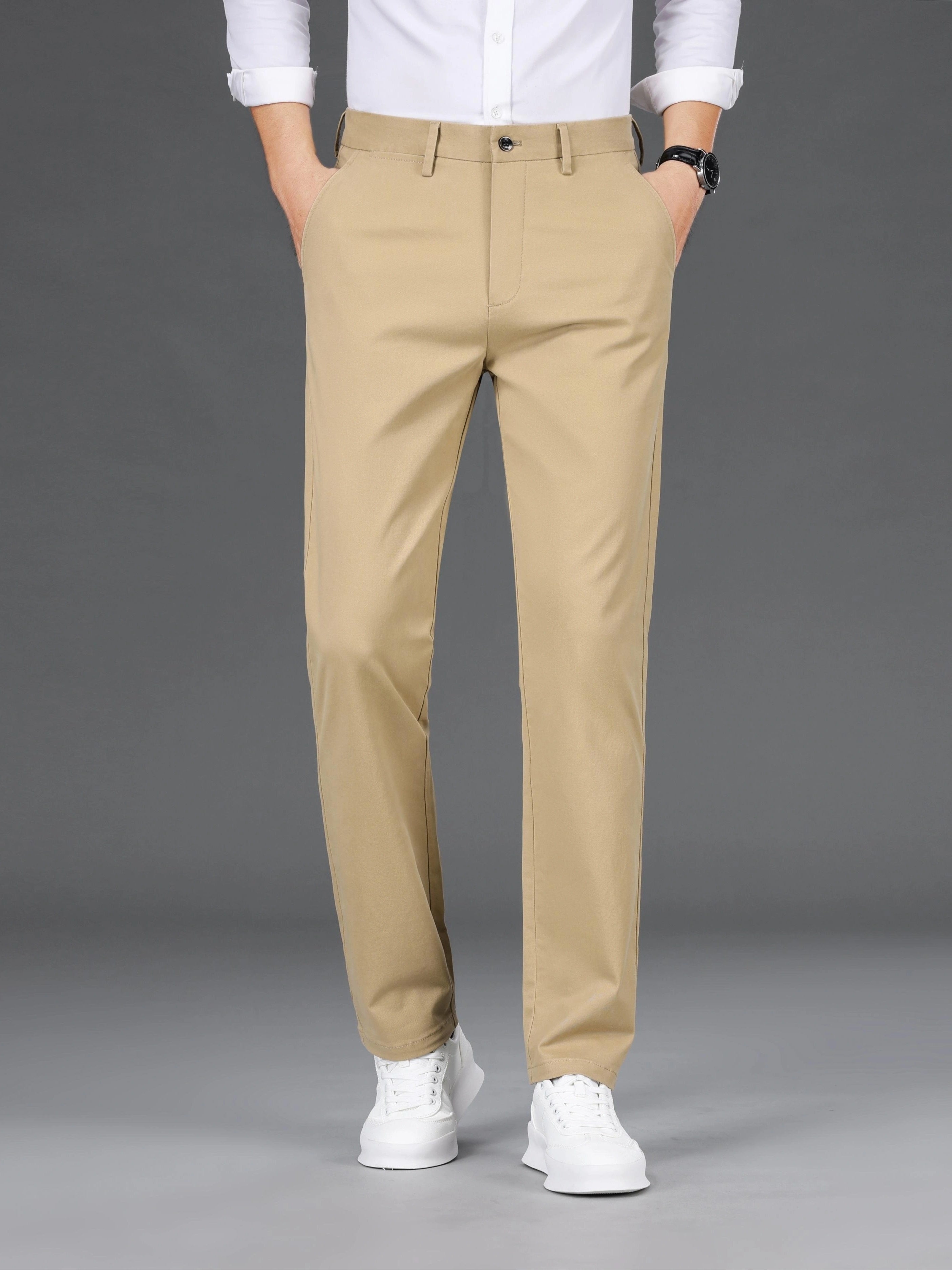 Men's slim-fit cotton blend trousers in solid color, suitable for business casual wear throughout the year. Features micro-elastic fabric, pockets, and regular length.