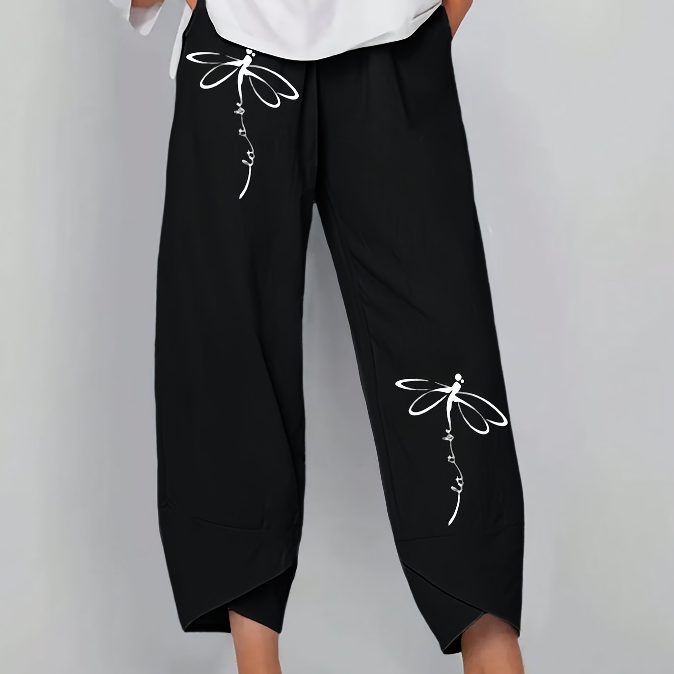 Baggy pants with dandelion print for plus size women, suitable for spring and fall.