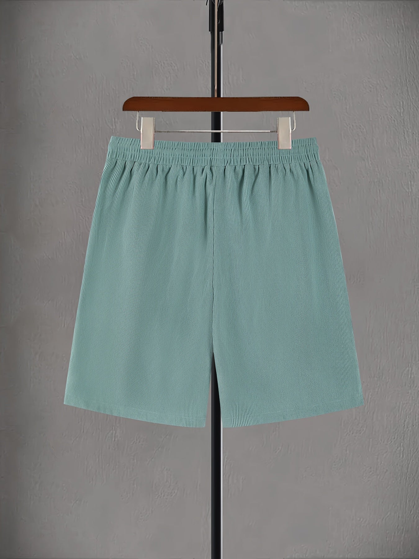 Plus size men's light green corduroy drawstring shorts with elastic waistband and pockets. Made of polyester fabric and machine washable. Perfect for summer.