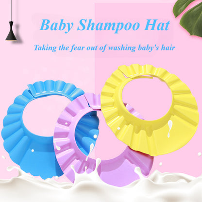 Adjustable baby shampoo cap in pink and yellow, made of soft polyester, protects eyes and ears during hair washing. Ideal for bathing and hair care.