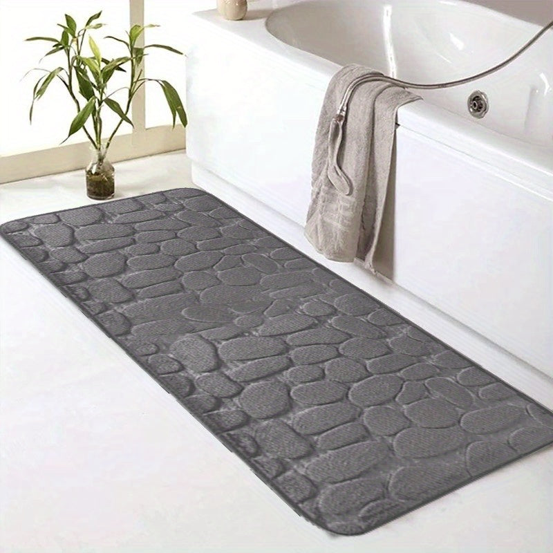 SoftTouch Cobblestone Pattern Memory Foam Bath Mat is machine washable and non-slip, making it a perfect addition to any bathroom. The absorbent polyester material resists stains, making it ideal for use in the bathtub or kitchen. This home decor runner