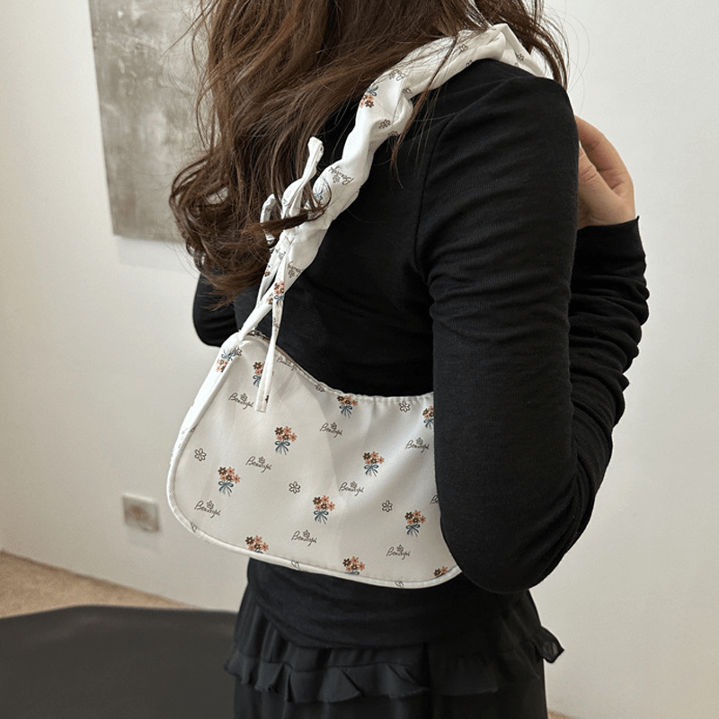 Stylish white and pink floral crossbody bag for women, suitable for daily use, travel, or as a gift.