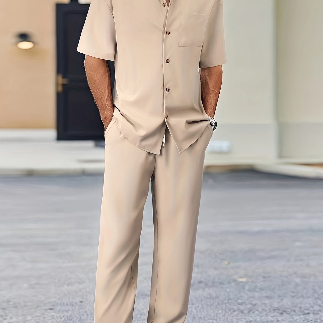 Men's casual suit-inspired set includes short sleeve shirt and loose straight pants made of polyester, machine washable.