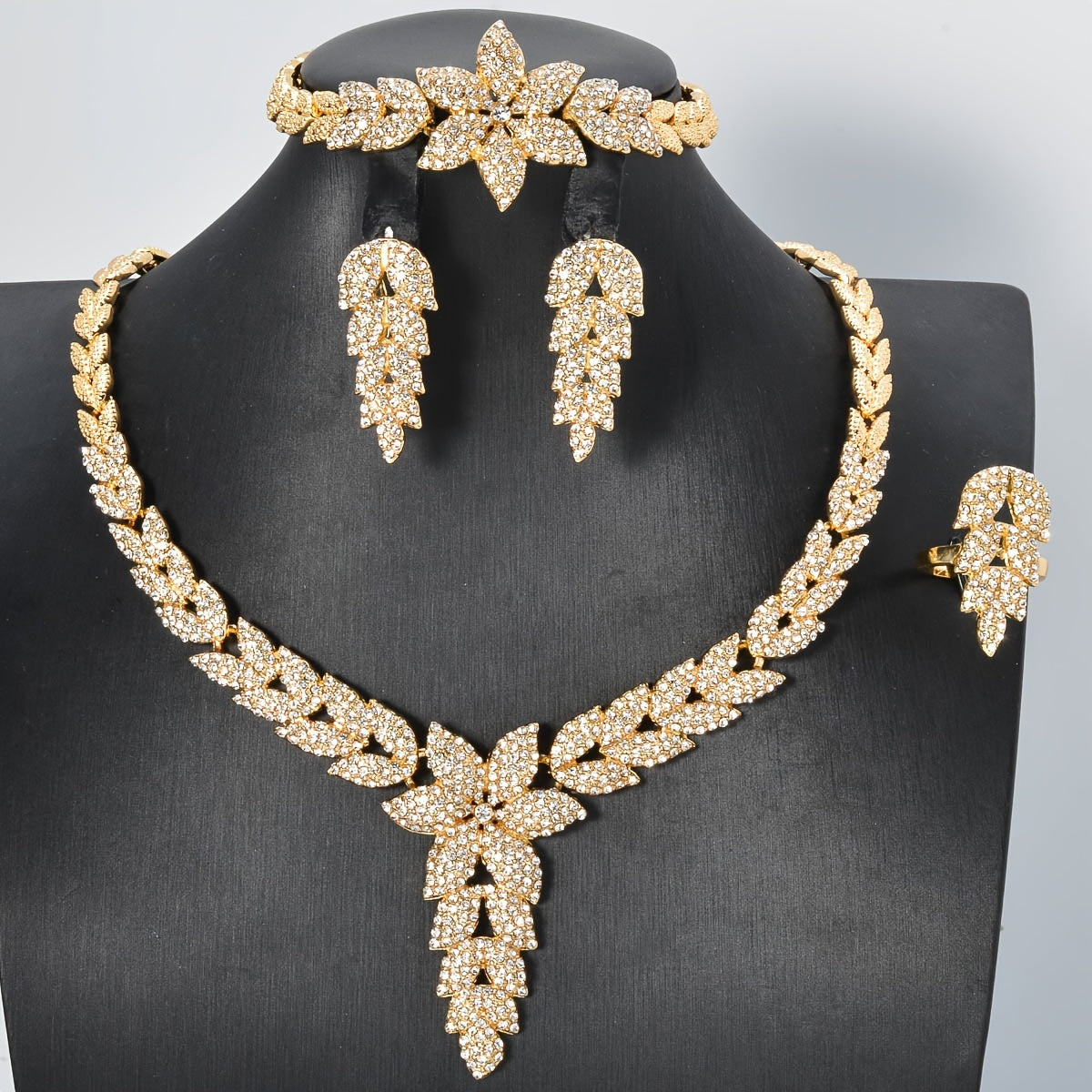 Get the ZEADEAR Luxury Elegant Flower Theme Jewelry Set for Weddings and Special Occasions, featuring high-quality -Plated Copper and Sparkling zirconia. This stunning set includes 1 Necklace, 1 Bracelet, 1 Ring, and 1 Pair of Earrings.