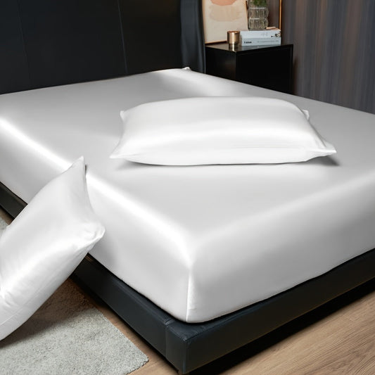 Indulge in the opulence of our luxurious satin-like fitted sheet and pillowcase set. This soft and smooth solid color set includes 1 fitted sheet and 1/2 pillowcase, making it perfect for enhancing your bedroom, guest room, or hotel suite. Crafted with