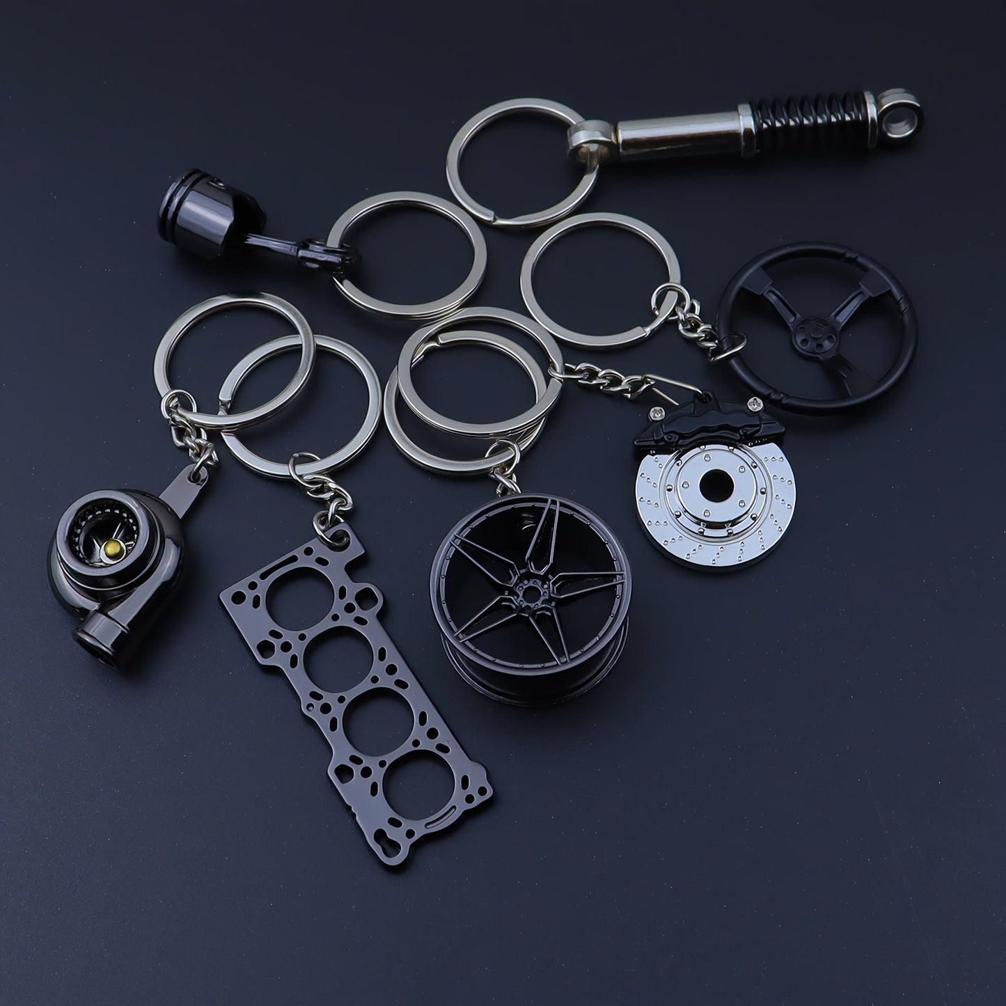 Set of 7 Car Enthusiast Keychains - Sleek Black Zinc Alloy, featuring Engine Block, Turbo, Wheel Hubs, and More - Ideal Gift for Guys