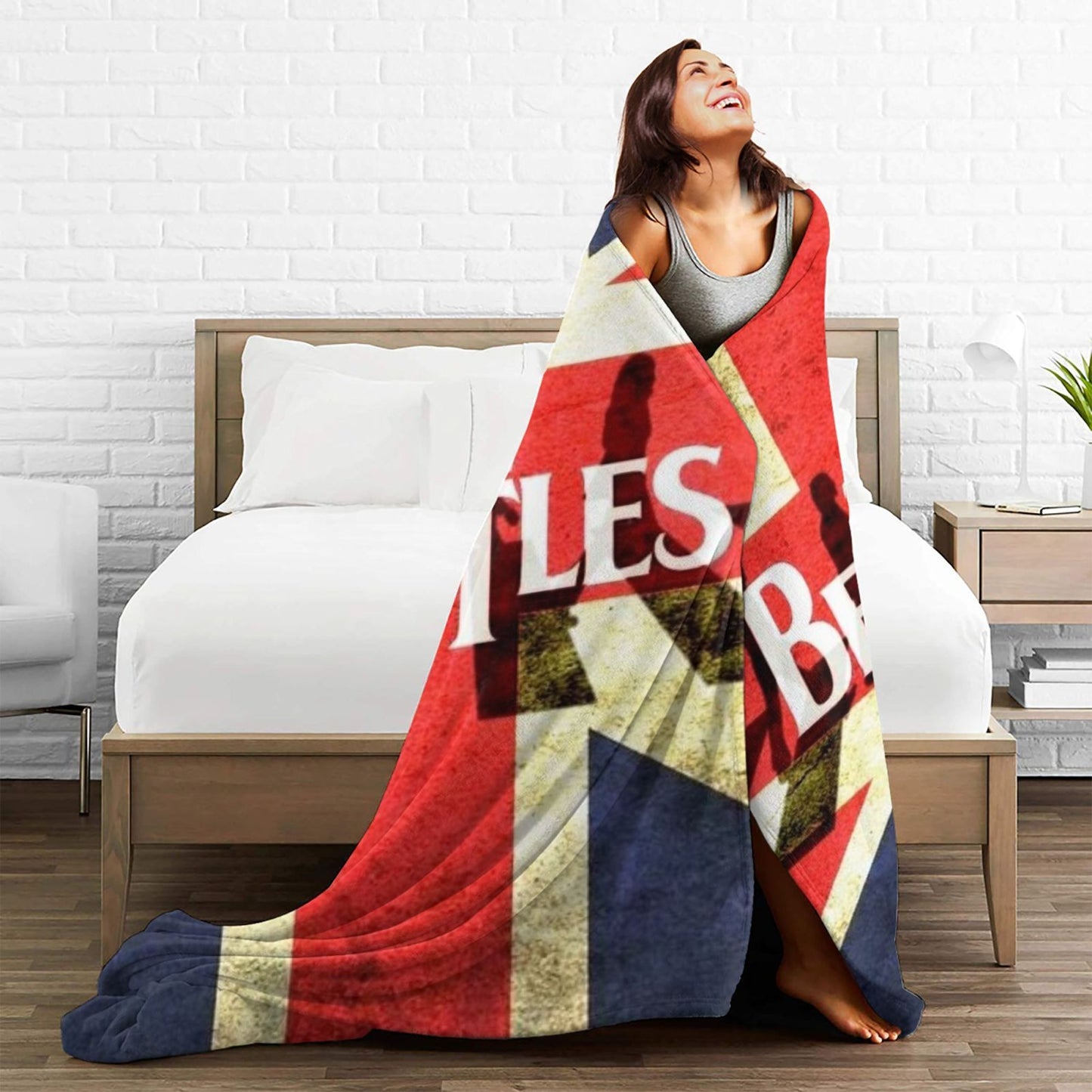 Stay warm and cozy with the ultra-soft Beatles Union Jack fleece throw blanket. Perfect for all seasons, this polyester blanket makes an ideal birthday or Christmas gift. With a contemporary style and knitted flannel in red, white, and blue, this blanket