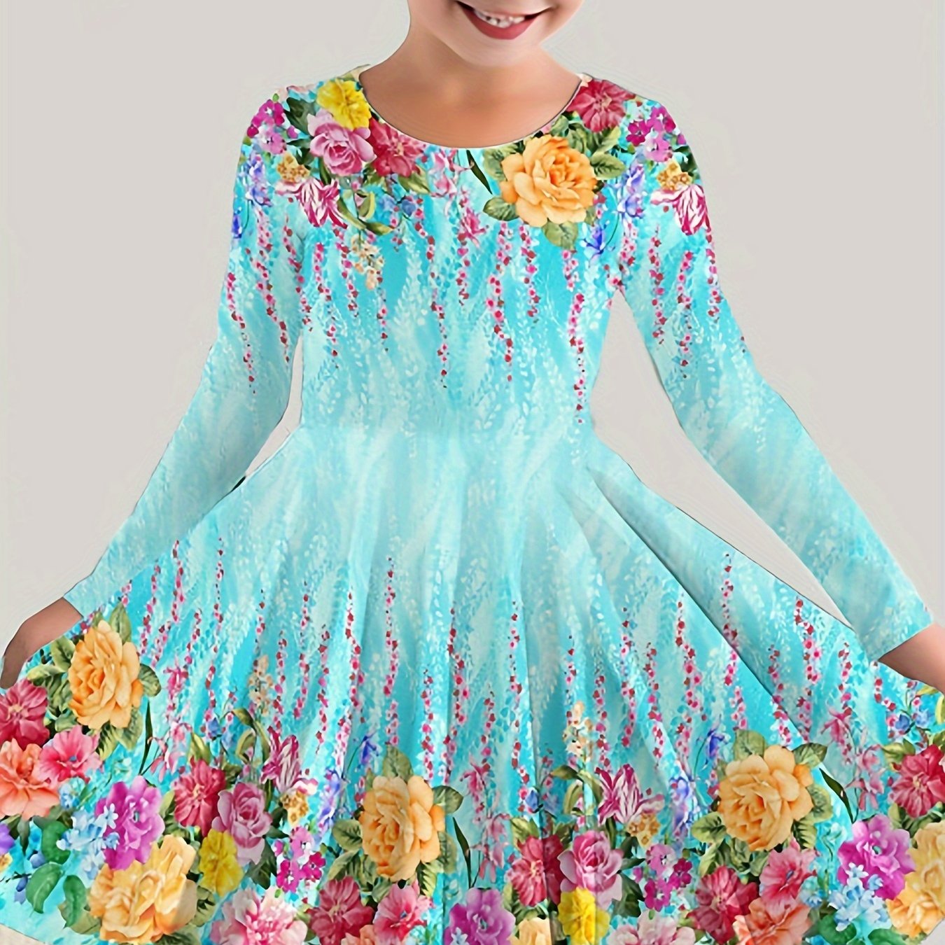 Stylish girls' long sleeve dress with bright floral print - made of stretchy, machine washable polyester for fall/winter.