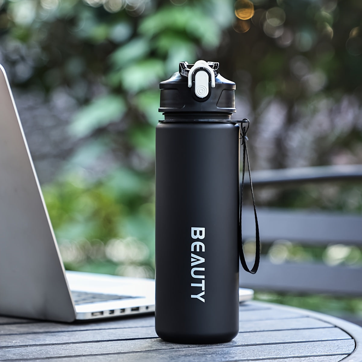 Durable, lightweight, and portable frosted plastic water bottle with scale for outdoor sports and office use.