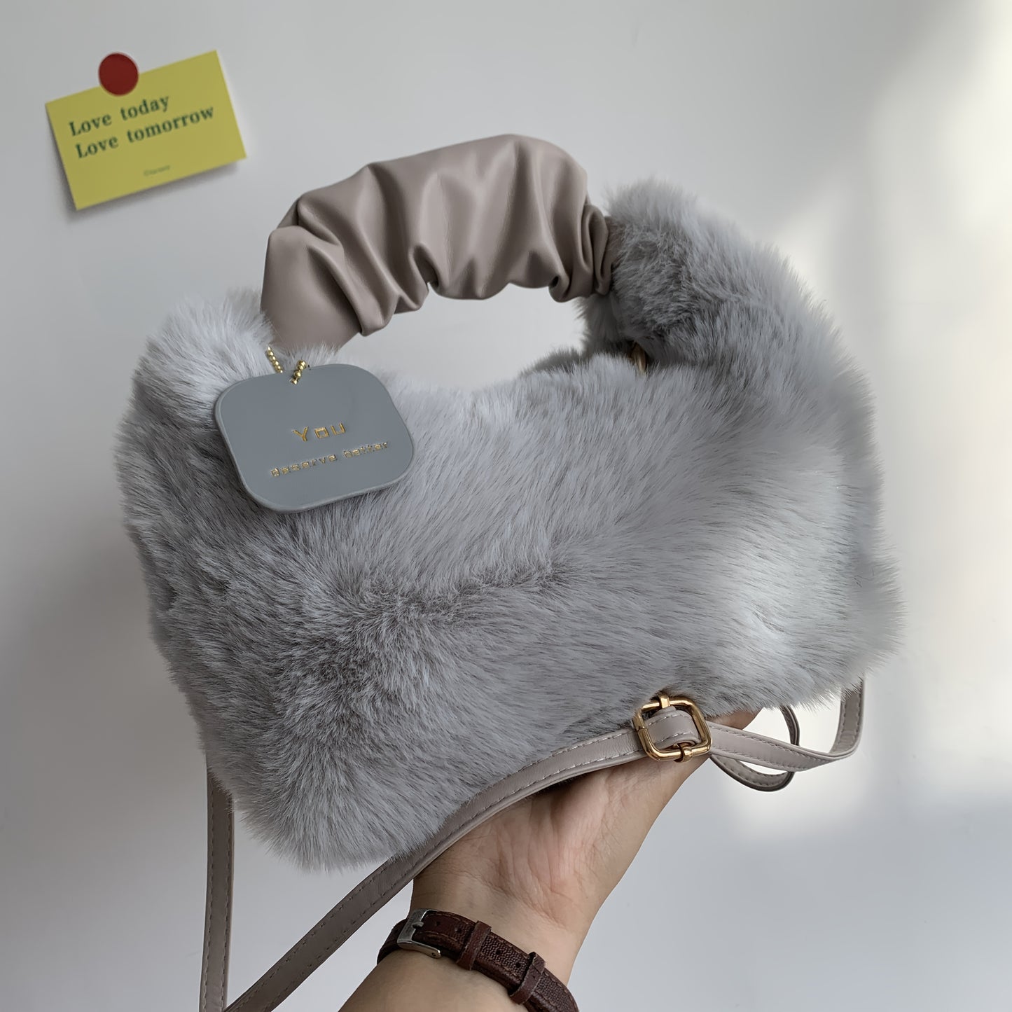 Stylish plush crossbody bag for women in faux fur with adjustable strap and zip closure. Perfect for fall/winter in khaki, light grey, dark khaki, cream, or pink.