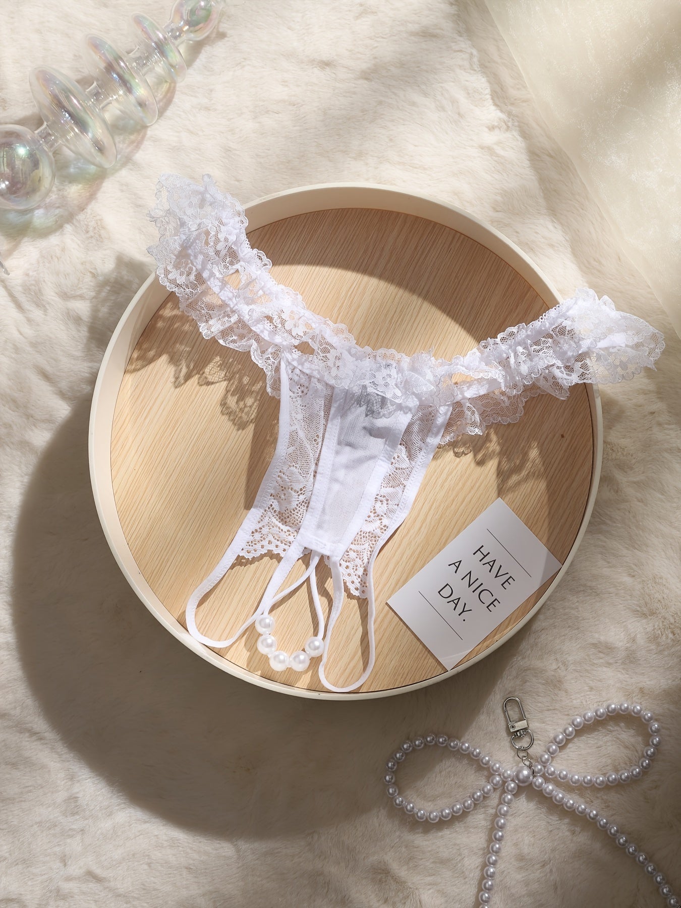 Ruffled lace thong with beads