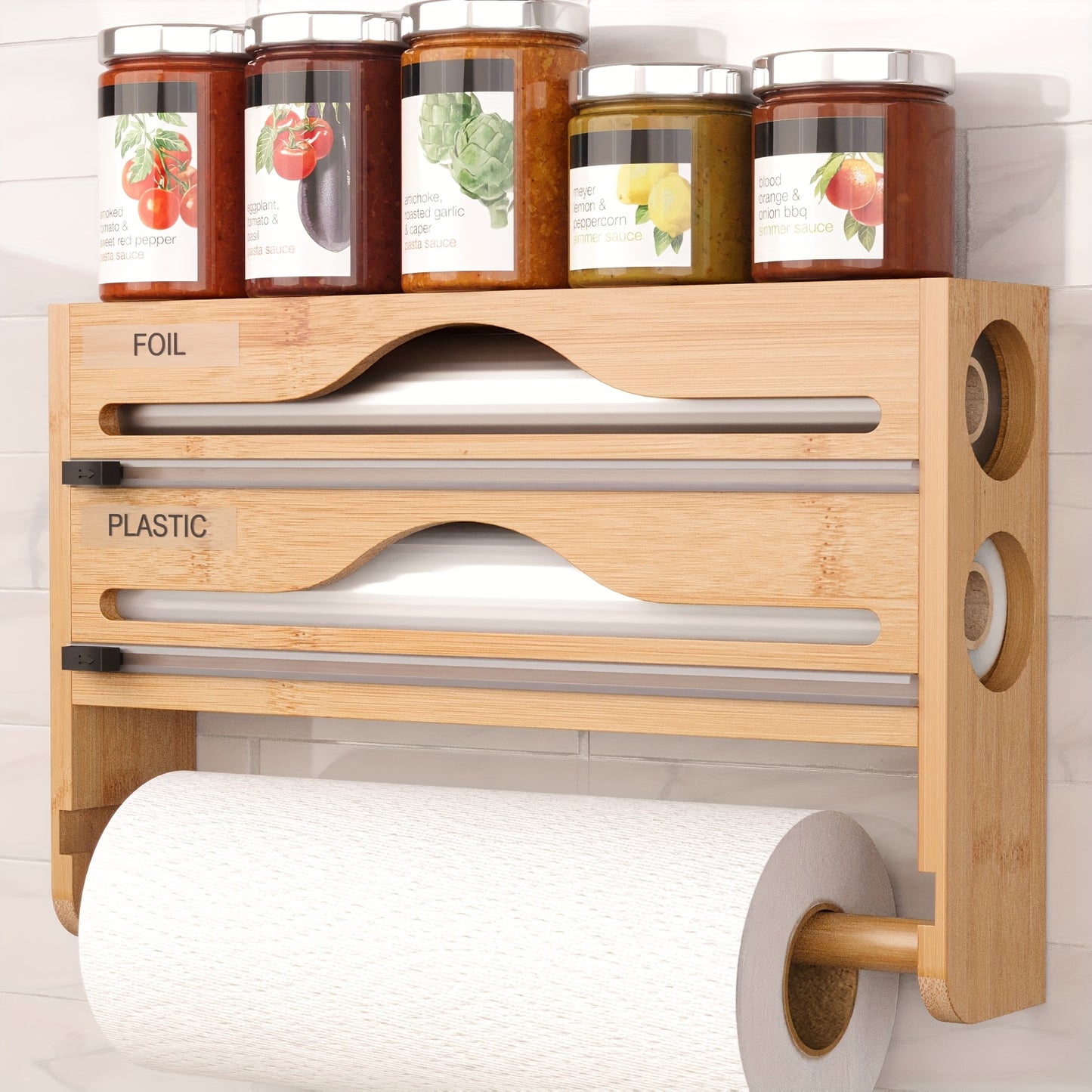 1pc 4-in-1 organizer for foil, plastic wrap, paper towels, and food dispenser with cutter for kitchen storage.