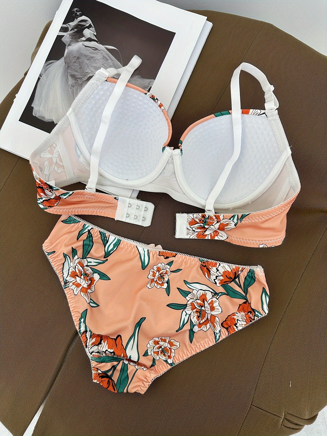 Floral bra and panty set with steel underwire and breast enhancement feature for women.