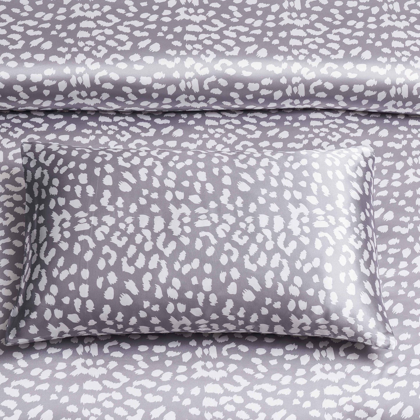 Two pieces of satin pillowcases with leopard print design