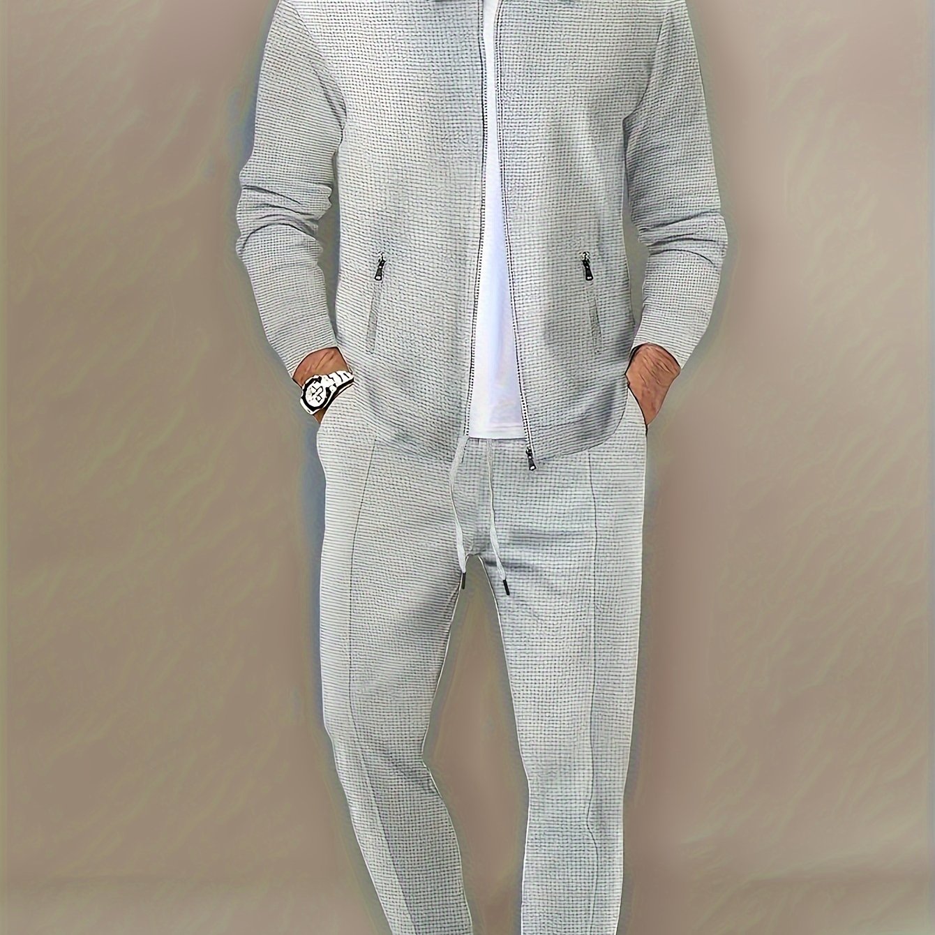 Men's casual zipper jacket and pants set made of machine washable polyester. Solid color with lapel collar for outdoor activities in spring, fall, and winter.