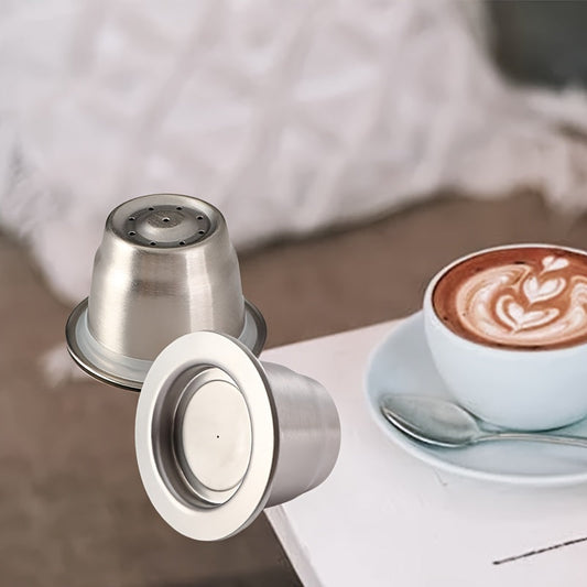 Reusable stainless steel Nespresso coffee capsule for home baristas, designed with a conical shape and flat bottom for improved brewing. Made with high-quality materials for a refillable and environmentally friendly option.