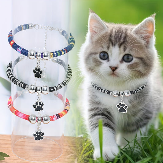 Durable, stylish, adjustable nylon pet necklace with colorful paw print pendant. Suitable for cats and small dogs.