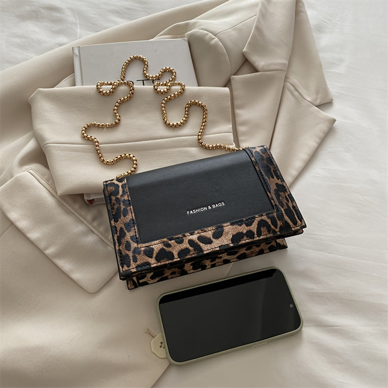 Stylish leopard print crossbody bag for women in black synthetic leather with golden-tone chain strap. Magnetic closure and large capacity, suitable for work, travel, and everyday use.